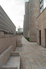 Obraz premium sidewalk paved with granite tiles in an urban environment.
