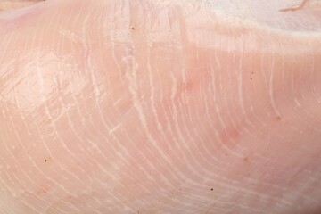 Fototapeta premium Raw turkey breast as background, closeup view