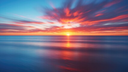 Vibrant sunset over calm ocean waters with colorful cloud patterns and reflective sunlight on the surface creating a serene atmosphere