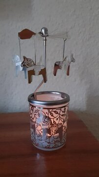 Dala horses, rotating candle holder. Vertical footage