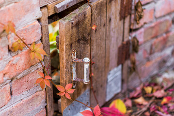 old secret door in a stone house, small door, pet enclosure