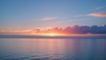 calm ocean at sunset with soft waves and colorful sky reflected on water surface