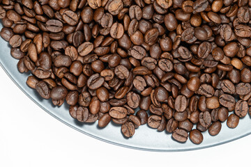Natural coffee beans pile top view.