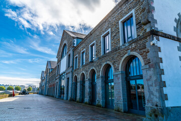A view along the old warehouses on the upper reaches of the Penfold river at Brest, France on a sunny day in autumn
