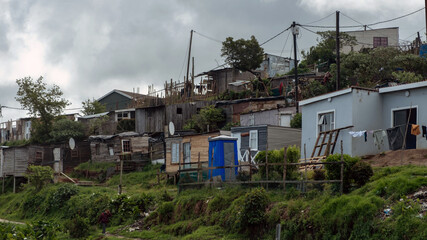 South Africa informal settlement on a hill, houses made of corrugated metal sheet and cardboard