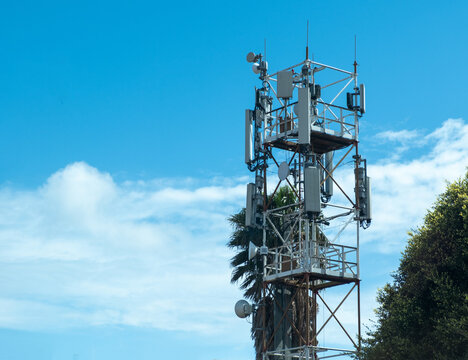 Telecom tower, cellular communication for 4g and 5g networks, wireless services. Blue sky