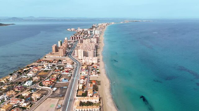 A stunning aerial video of La Manga, Murcia, showcases the beautiful beaches and the sparkling sea on both sides, highlighting the unique landscape and vibrant atmosphere of this coastal paradise