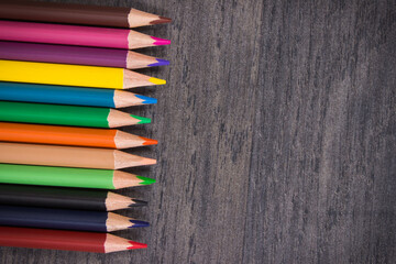 Crayons using for drawing, learning and developing creativity at school. Place for text board