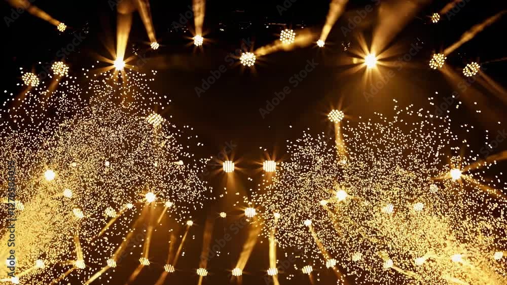 Poster A dynamic video captures a low-angle view of a stage with vibrant blue and gold lights forming a triangular pattern, creating a lively concert atmosphere.