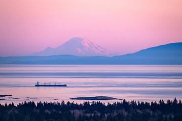 Sunset view of Mount Rainier from Mount Douglas Regional Park in Victoria, BC, Canada