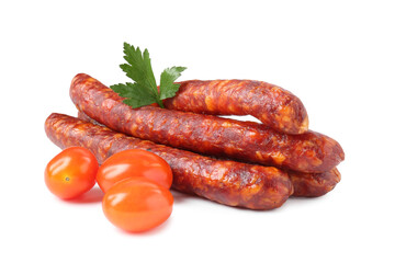 Many thin dry cured sausages with parsley and tomatoes isolated on white