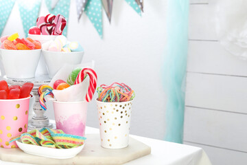 Candy bar. Different yummy sweets on white table indoors. Space for text