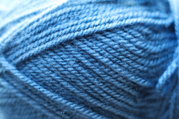 Blue skeins of wool as background, closeup. Yarn for knitting
