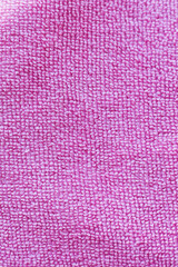 Close up of pink microfiber cloth texture. Abstract background.