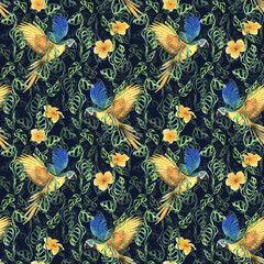 Tropical palm leaves, monstera and flowers of plumeria, hibiscus, bright juicy with blue-yellow macaw parrot. Hand drawn watercolor botanical illustration. Seamless pattern on the dark background.