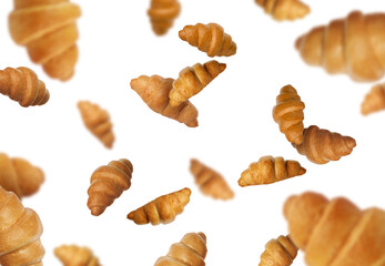 Delicious croissants in air on white background. Puff pastry