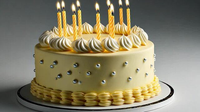 A stunning cake awaits to mark a memorable celebration, complete with candles ready to be lit and delightful frosting decoration