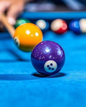 Pool player aiming cue stick at purple ball