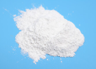 Talc powder on blue background