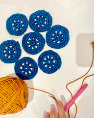 skeins of knitting yarn and circular patterned knitting
