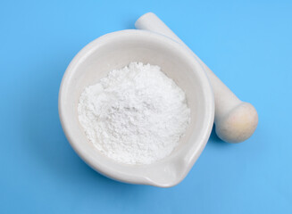 Talc powder on blue background