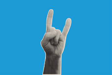 Halftone hand showing the rock and roll sign. Dot effect gesture on blue background. Black and white Rockstar expressing symbol.