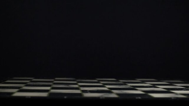 Slow rotation of an empty chessboard