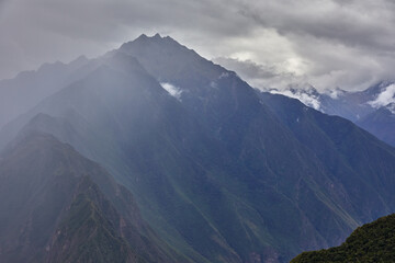 Fototapeta premium Choquequirao’s rugged terrain tests the spirit of adventure with every step. Carved by time and nature, these dramatic Andean slopes lead to one of Peru’s most awe-inspiring hidden treasures.