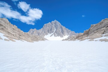 Fototapeta premium Majestic mountain peak rises above expansive white snowfield und