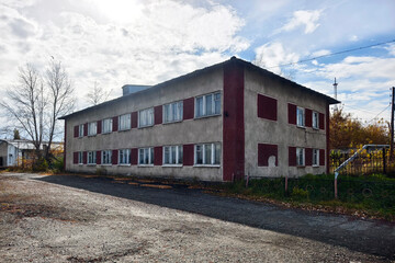 Obraz premium Typical Soviet architecture. A cheap old typical house in post-Soviet countries. Facade of high storey, residential, soviet of flats house.
