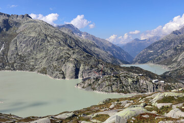 Grimsel Pass in the Bernese Alps. View of the artificial lakes Grimselsee and Raeterichsbodensee - hydroelectric reservoirs for the Grimsel Pass Dam. Canton of Bern, Switzerland