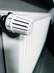 thermostat controller with numbers on the wall radiator