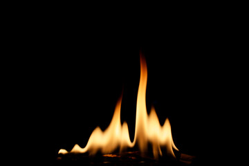 Flames Dancing on a Dark Background Creating a Warm Atmosphere