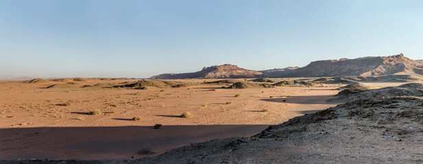 Fototapeta premium sandy desert and rocky hills from above, near Twyfelfontein, Namibia