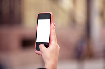 Woman's hand holding a smartphone with a blank white screen