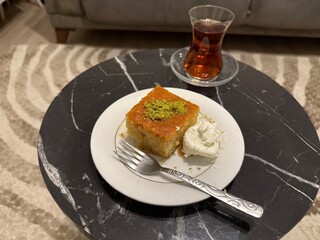 Ramadan dessert revani with turkish traditional tea at local home