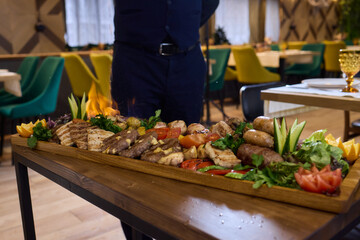 An Exquisite Gourmet Platter featuring an array of Succulent Meats alongside Fresh Vegetables