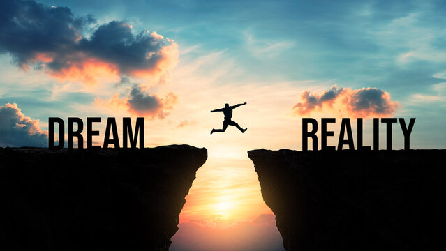 Silhouette of a person jumping from dream to reality over a gap between cliffs at sunset, achieving goals concept, turning aspirations into success, motivation and ambition symbol
