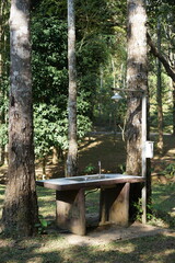 Outdoor sink area for washing dishes at a campground. Clean up from dinner. Scrub your pots and pans. Off the grid. Cook your own food.
