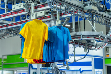 clothes are being conveyed to automatic machine