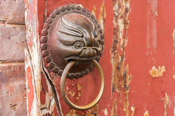 traditional chinese temple with guardian door knockers