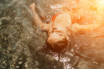 Fototapeta premium Happy woman sea relaxing floating in transparent sea water on summer holiday. Travel leisure recreation lifestyle, female in nature.
