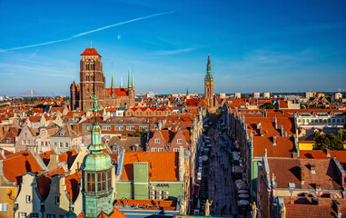 Aerial view of Gdansk at sunset, showcasing the downtown area and St. Mary's Basilica. The...