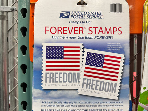 Maplewood, Minnesota - February 17, 2025: Placard to purchase USPS Forever Stamps at a Costco store