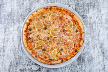 fresh pizza on the white plate
