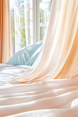 Sunlight streams through sheer curtains onto a bed