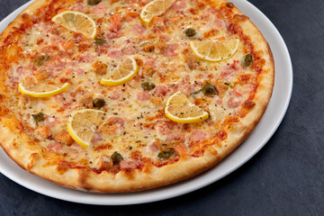 fresh pizza on the white plate