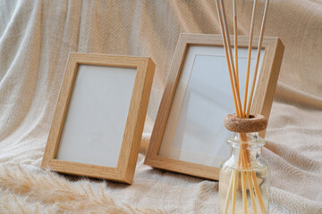 Minimalist wooden frame mockup on nude fabric background. Blank photo frame for artwork, photography, or design presentation. Neutral tones, soft shadows, Scandinavian boho interior style.