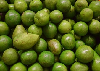 a pile of fresh avocados