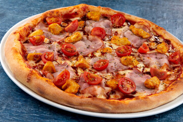 fresh pizza on the white plate